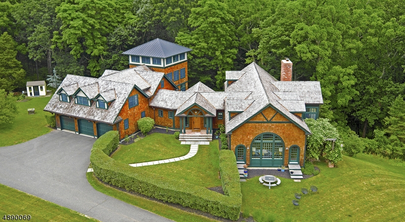 Outstanding shingle style home custom built 2008 w/ the finest of finishes.  Open, well-designed sun filled floor plan, lux master suite, lookout tower, walkout fin LL, pond, pastoral grounds, orchard Exceptional attention to detail throughout.  Custom tile, wide beamed floors, reclaimed barn beams, 5 fireplaces crafted from vintage brick and unique stone surrounds.  First floor master suite with spa-like bath.  On the second level, 2 additional BRs with additional office, and family room/den in lookout tower room on the second level.  Recreation room,office, two full Baths, steam shower and Artist studio/workshop with fpl complete the walkout lower level.  Serene outdoor setting with outdoor fireplace and multiple french doors out to lovely views.