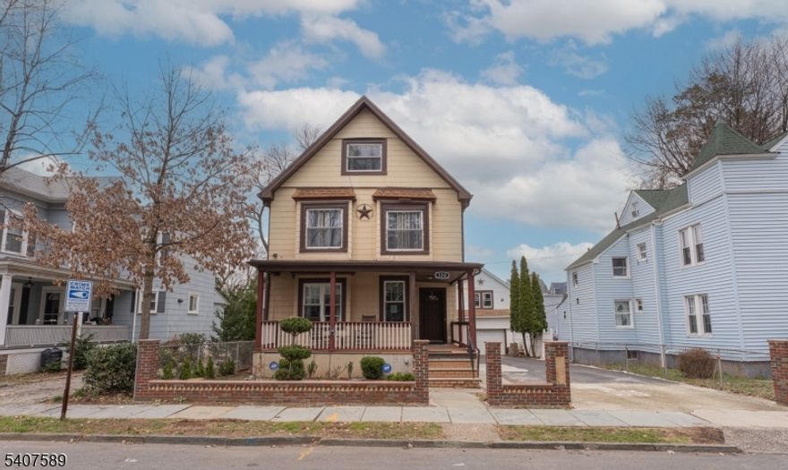 Beautifully maintained traditional home offering 8 rooms, 3 bedrooms, and 2 full baths. Enjoy a large, inviting wraparound porch and a rear deck ideal for entertaining and gatherings. The expansive blacktop driveway provides ample parking and leads to an oversized 2-car garage with a second-story loft/workshop perfect for storage, hobbies, or workspace. Situated on a level lot, this home features high ceilings, a bright eat-in kitchen, and a versatile unfinished basement. Thoughtfully designed with space for everything, this property offers comfort, functionality, and endless potential.