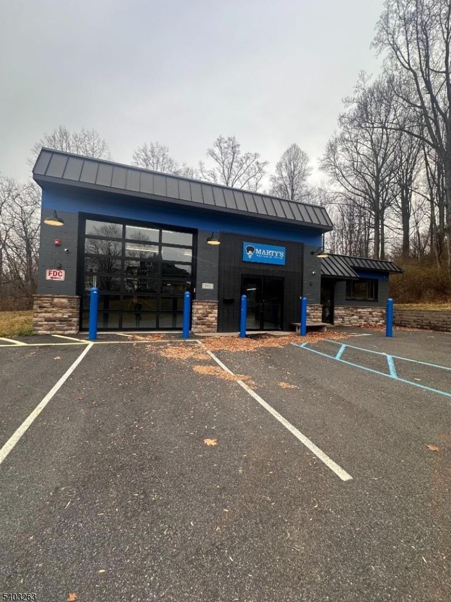 Fully renovated 3,800 SF free-standing commercial building available for lease in the heart of High Bridge. This versatile property features approximately 12' ceilings, a sprinklered interior, all-new systems, updated electric, and a flexible open floor plan adaptable to a wide range of business uses.The building is equipped with extensive hard-wired security cameras throughout, a Bluetooth-controlled garage door entering an epoxy floor room, baseboard heat, and new high-efficiency ductless split cooling units. Additional improvements include a private back office, kitchenette, and a Comprehensive Compressed Air Distribution System, ideal for light industrial, studio, or specialty commercial users. Situated on a 0.34-acre lot within the Downtown Business Zone, permitted uses include retail, professional office, medical/health services, studio, and mixed-use, among others. A true turnkey opportunity in a prime Main Street location. Strong visibility and accessibility. Formerly home to Marty's Bike Shop. More photos coming soon!