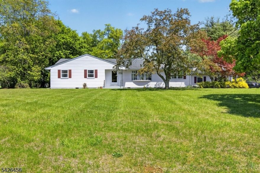 Welcome to this beautifully maintained 4-bedroom, 2 full bath ranch nestled on a serene 1-acre lot in a quiet cul-de-sac community in the heart of Hillsborough. This cozy and inviting home offers the perfect blend of comfort, privacy, and convenience. Step inside to find hardwood floors and a freshly painted interior that creates a warm, move-in-ready feel. The spacious updated eat-in kitchen and separate dining room make it ideal for both everyday living and entertaining. Sliding glass doors from the dining room lead to an exquisite, paved brick patio, perfect for relaxing or hosting gatherings while enjoying the privacy of your expansive lot. The primary bedroom features a private full bath w/stall shower, while 3 additional generously-sized bedrooms are complemented by a second full bath. A convenient first-floor laundry room and interior access to the garage enhances everyday functionality. Major systems have been updated with a furnace (2019) and water heater (2019), offering added peace of mind. Located in sought-after Hillsborough, known for its top-rated schools, this home provides easy access to NYC train lines and is close to outdoor destinations like the Sourland Mountains and Duke Island Park. Enjoy being just minutes from the vibrant downtowns of Princeton, Bridgewater, and Somerville for dining, shopping, and entertainment. Don't miss the opportunity to own this charming retreat in one of Hillsborough's most desirable settings! Additional photos coming.