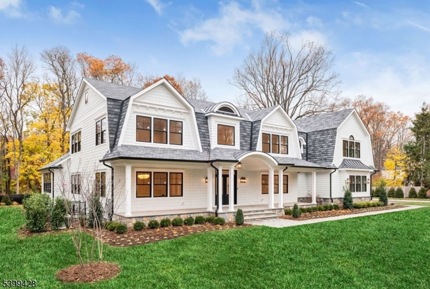 Stunning NEW construction Hampton style home located on the East Hill of Upper Saddle River is the epitome of luxury. This custom-built masterpiece by high end builder showcases 7,961 sq ft on 3 levels. Gorgeous exterior w/ covered front porch, sweeping roof lines & large level property. Enter to a 2 story EF w/ wide plank white oak floors, banquet size DR w/cstm clg, large LR w/panel walls. Dream designer kitchen w/ breakfast rm with all the amenities, custom island, high end appliances, built-in coffee bar, opens to outdoor living space w/raised 36' x18' bluestone patio w/outdoor kitch & FP. 2-story great rm w/ vaulted ceiling, custom beams & FP opens to patio. First fl BR, full bath, pantry, butler pantry, powder rm, & built-in mudroom area w/ access to 3-car garage w/ EV charger complete the 1st level. The second level offers 5 large BRs, 3 en-suite, 2 Jack & Jill, office, & laundry rm. The primary suite is a masterpiece w/ vaulted ceiling showcasing custom beams, FP, 2 WICs, & luxurious bath w/ oversized marble shower, dual vanity & soaking tub. The finished lower lvl offers a 7th BR, full bath, gym, theater, rec area, kitchen, & 2nd laundry rm. CAT5 cables all BRs, gym, theater, office, & great rm. Movie rm w/ 120 in. retractable acoustic weave screen, projector w/ wall speaker subwoofers & data tower. Security w/ 16 port w/ 9 cameras. Prewired for 6 Wifi hotspots. Wired speakers and dedicated amps to kitch, back patio & gym. 26 KW generator. Truly exceptional!