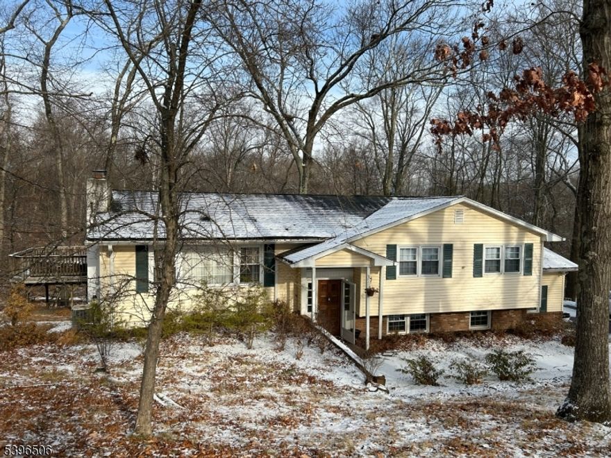 Set on 1.26 acres at the end of a quiet cul-de-sac, this refined 4-bedroom, 3-bath bi-level offers an exceptional blend of privacy, space, and modern comfort. Offered as a rental for the entire home, this property provides the rare opportunity to enjoy single-family living with no shared spaces. A light-filled, open-concept layout showcases hardwood floors creating an elegant yet inviting atmosphere throughout. The designer-inspired kitchen anchors the main living space and features granite countertops, stainless steel appliances, and a center island with breakfast seating, seamlessly connecting to the dining and living areas. The living room is enhanced by a wood-burning fireplace and French doors that open to a sprawling deck overlooking the tranquil, wooded setting perfect for elevated entertaining or quiet relaxation. The primary suite serves as a private retreat with its own bath and three closets, while the ground-level fourth bedroom or home office offers flexibility with a private entrance. The lower level is completed by a spacious family room, laundry area, and walkout access to a patio ideal for indoor-outdoor living. Additional highlights include an attached two-car garage, central air, and natural gas. Ideally located in Raritan Township within the Hunterdon Central School District, the home is just minutes from Route 31, downtown Flemington, and local shopping and dining.