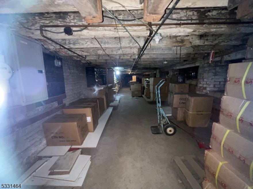 This property is located in the center of the Ironbound District of Newark, featuring one commercial storefront and two residential apartments, all currently rented on a month-to-month basis. Each unit has separate utilities, offering easy management and maintenance. With a full basement for extra storage, this property provides flexibility for both business and rental income.The Ironbound District is known for its cultural diversity along with excellent dining and retail options. It's well-connected by public transportation, with easy access to Newark Penn Station and major transit lines to New York City. Newark Liberty International Airport and major highways are also just minutes away, adding to the convenience. This property offers a unique opportunity for investors or business owners looking to take advantage of a dynamic, well-connected location.