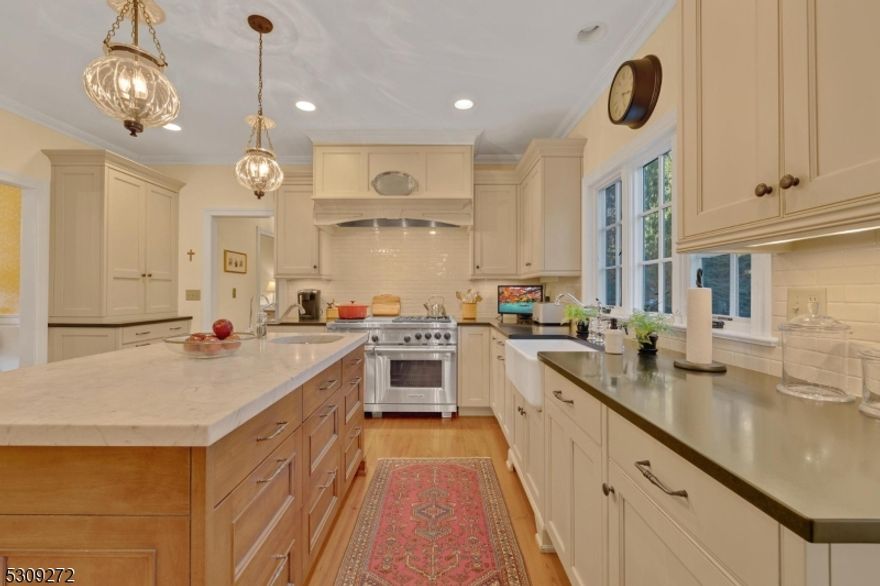 Beautifully updated traditional colonial on fantastic cul-de-sac location, overlooking bucolic pond w/impressive details, and offering many updates. Foyer w/wide plank pine flooring, formal living room w/oak flooring, charming window seat and French doors to family room, dining room w/raised panel moldings, oak flooring and extended window for ample space. European country eat-in kitchen features white wood cabinets, center island w/marble counter top, surrounding cabinets w/granite counters, Sub-Zero refrigerator/freezer, Wolf 6 burner stove w/griddle, double ovens, range hood, farm sink plus veggie sink, generous sized pantry. 1st floor guest room w/oak flooring, built-in shelving, updated full bath, half bath w/soapstone counter tops, pine flooring; family room w/oak floors, recessed lighting, wood burning fireplace w/stone surround. Upper level offers spacious primary suite w/oak flooring, sitting room, walk-in + 2 double closets, full bath w/double vanity, marble flooring and countertops, stall shower and soaking tub. 3 additional BRs, guest bath, cherry paneled office w/separate staircase to 1st floor complete the living space. Finished basement adds living space with recreation room, wine cellar, powder room with marble vanity, storage closets and more. 3 Car attached garage, built-in generator, new cedar shingle roof, new cedar perimeter fence to be completed January; inground pool (sold as-is), newer water heater, central vac, Bernardsville schools, and much more.