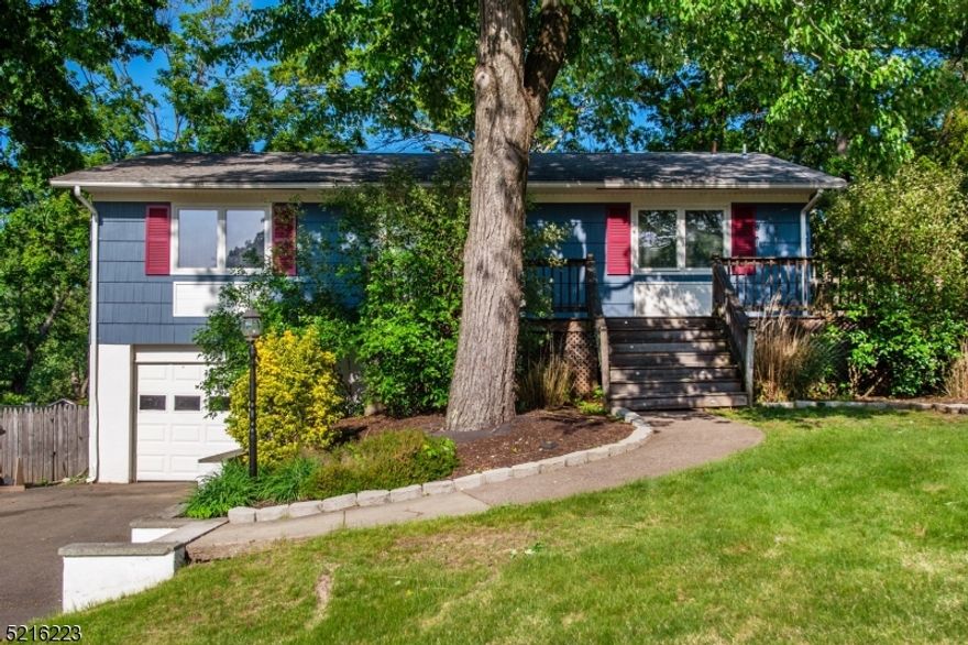 Beautiful single family home ideal for entertaining inside and out! Hardwood throughout with oversized living room and a dining room that flows into the deck that overlooks fenced in backyard! Eat-in kitchen includes smart refrigerator, dishwasher & gas stove. Basement boasts an exercise room (or office), spacious family room with dry bar, an additional full bath, garage access and laundry! This is the ideal home with central air, garage, natural gas and public utilities. Lots of storage space! Close to public transportation, shopping, grocery stores, highways and under 1 hour from NYC!