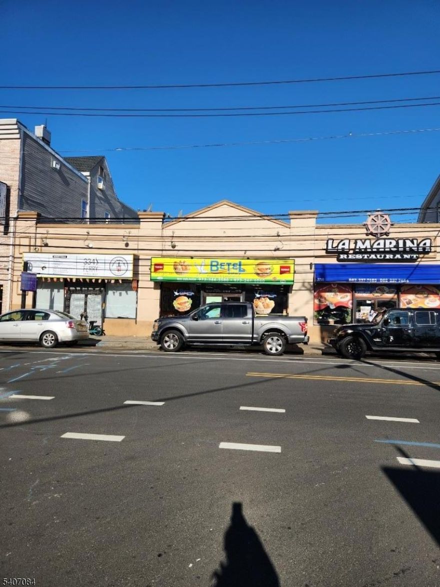 Prime commercial property located on high-traffic Ferry Street in Newark?s desirable Ironbound district. The building features three commercial units, with two long-term, income-producing tenants and one vacant unit, offering immediate upside and value-add potential. Excellent street visibility, strong foot traffic, and proximity to public transportation and established businesses make this a solid asset for investors seeking stable cash flow with growth opportunity.