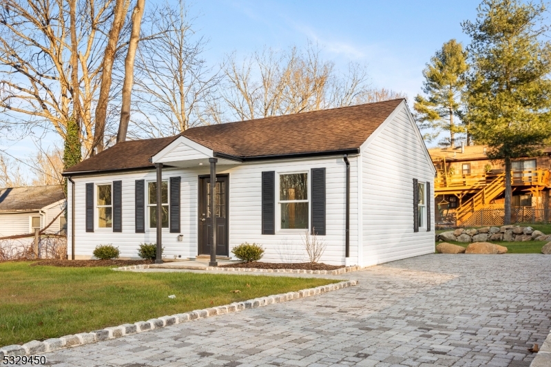 Welcome home to this stunning fully renovated Ranch is a true gem, perfectly situated in the picturesque town of Ringwood, New Jersey. Boasting a desirable blend of modern updates and classic charm, this property is ideal for those seeking a serene lifestyle with convenience. Enjoy a partially open concept design that seamlessly connects living spaces, creating an inviting atmosphere perfect for entertaining and gatherings. The heart of the home features a brand-new kitchen equipped with modern appliances, sleek cabinetry, and ample counter space, making meal preparation a joyous experience. The comfortable living area is adorned with engineered hard wood flooring throughout, providing durability and ease of maintenance while adding a touch of elegance to the home. With a brand-new HVAC, you can rest assured that this home is energy-efficient and equipped for year-round comfort. The property features a beautifully paved driveway, leading to a landscaped yard that is perfect for outdoor activities and relaxation. Conveniently located near highways, places of worship, and schools, this home offers easy access to all the amenities you need while maintaining a peaceful suburban vibe. Don't miss out on the opportunity to make this stunning ranch your new home! Schedule a viewing today and experience the perfect blend of comfort and style.