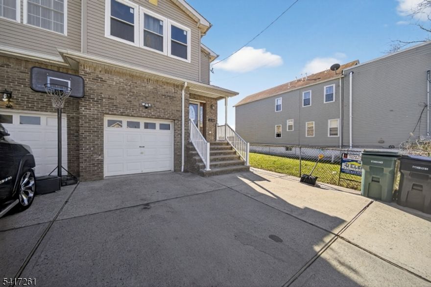 Spacious Duplex, 3 bedrooms and 2 1/2 baths, foyer with coat closet, center block basement, fenced in backyard, garage and near waterfront on a deadend street. Appliances as is. New Front door and New Luxury vinyl floors on main level.