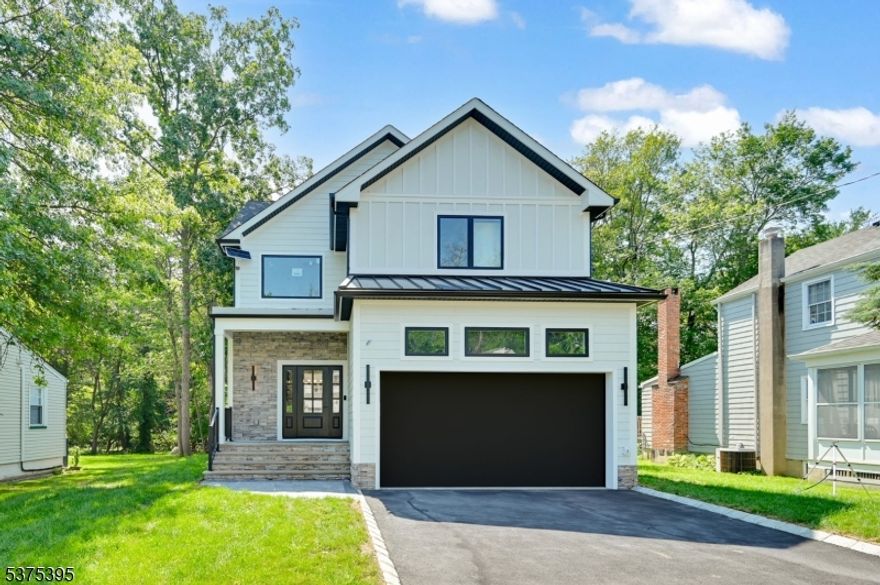 Welcome to this stunning 6-bedroom, 5-bath custom new construction home, thoughtfully crafted across 3 levels and perfectly situated on a flat lot with a fenced backyard and attached 2-car garage. Step into the impressive 2-story foyer, where wide-plank flooring, detailed trim work, and an open-concept layout create an elegant first impression. The formal dining room leads into a designer kitchen equipped with high-end stainless steel appliances, quartz countertops, a center island, and a walk-in pantry. The adjacent family room features a sleek electric fireplace and sliding glass doors that open to the backyard perfect for seamless indoor-outdoor living. A private guest suite with full bath, a stylish mudroom with built-ins, and direct garage access complete the main level. Upstairs, the luxurious primary suite offers dual walk-in closets and a spa-inspired bath with soaking tub, stall shower, and double vanities. A junior ensuite, two additional bedrooms with walk-in closets, a beautifully appointed hall bath, and a spacious laundry room round out the second floor. The fully finished lower level offers a 6th bedroom, and full bath, a large rec room with wet bar, ideal for a media room, gym, playroom, or extended-stay guests. Located near top-rated Livingston schools, shopping, and commuter routes, this home blends modern luxury with everyday convenience. Includes a 10-Year Builder's Warranty.