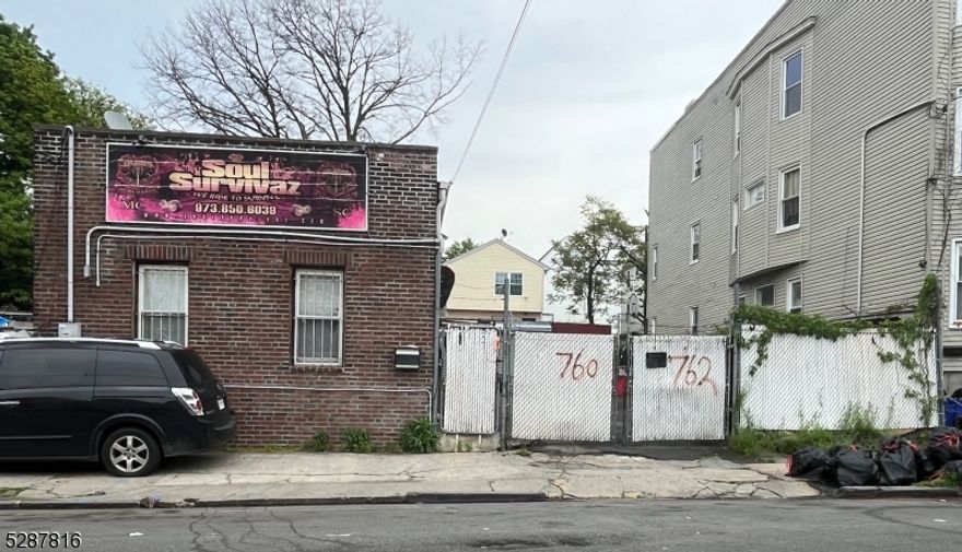 2 lots for sale together with 25x100 each. Presently used as a motorcycle Club paying $3,500.00 per month basis.Redevelopment zoning and can build 12-16 apartments or 2 x 3 or 4 units in each lot.