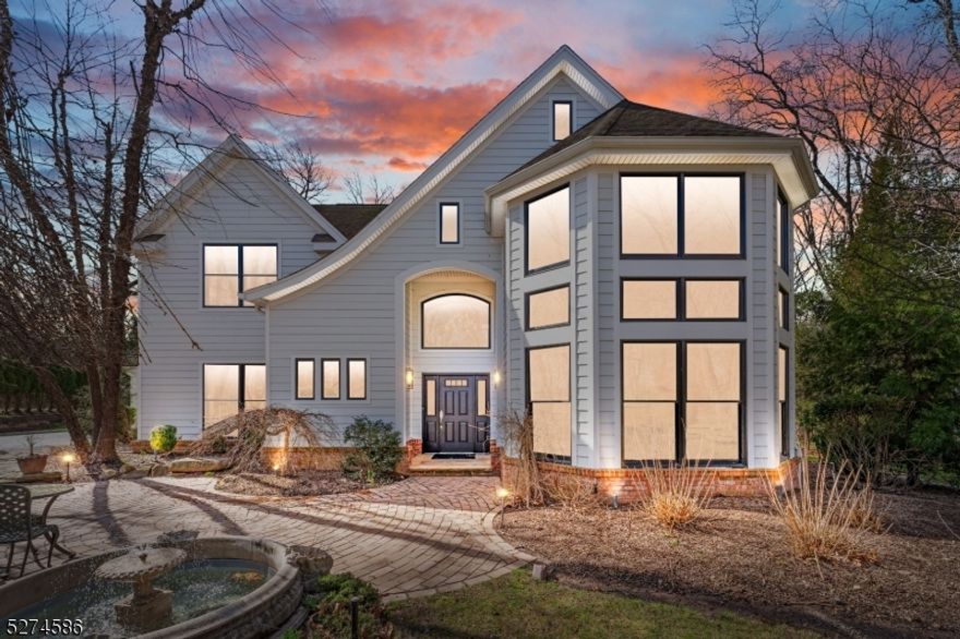 Step into this exquisite CUSTOM center hall colonial where classic elegance meets modern luxury. This 7,000+/- SF home boasts 5 BEDS / 4.2 BATHS across three finished levels. Situated on a quiet cul-de-sac, this property is conveniently located near top-rated schools & NYC transportation. The breathtaking two-story foyer welcomes you to an open-concept floor plan. The great room boasts floor-to-ceiling windows and offers tons of natural light. The spacious dining room is adjacent to the renovated gourmet kitchen equipped with high-end appliances, a dry bar, and a butler's pantry. The EIK extends to a spacious backyard patio with an outdoor kitchen and built-in firepit. The living room & family room share a double-sided fireplace creating a comfortable & cozy atmosphere. The 2016 rear addition, incorporates a mudroom, laundry room, access to the three-car garage, and an expansive game room with a vaulted ceiling. The game room is equipped with a wet bar & folding glass doors that open to the covered patio, an ideal setting for seamless indoor/outdoor entertaining. Upstairs the primary suite awaits, complete with a sitting area, a spa-like bath, and a spacious walk-in closet. Three additional bedrooms and 2 full baths complete this level. The finished lower level provides an additional guest suite, full bath, office area, home gym, wine cellar, a well-appointed media room & ample storage. This home assures a lifestyle of unparalleled convenience and luxury.