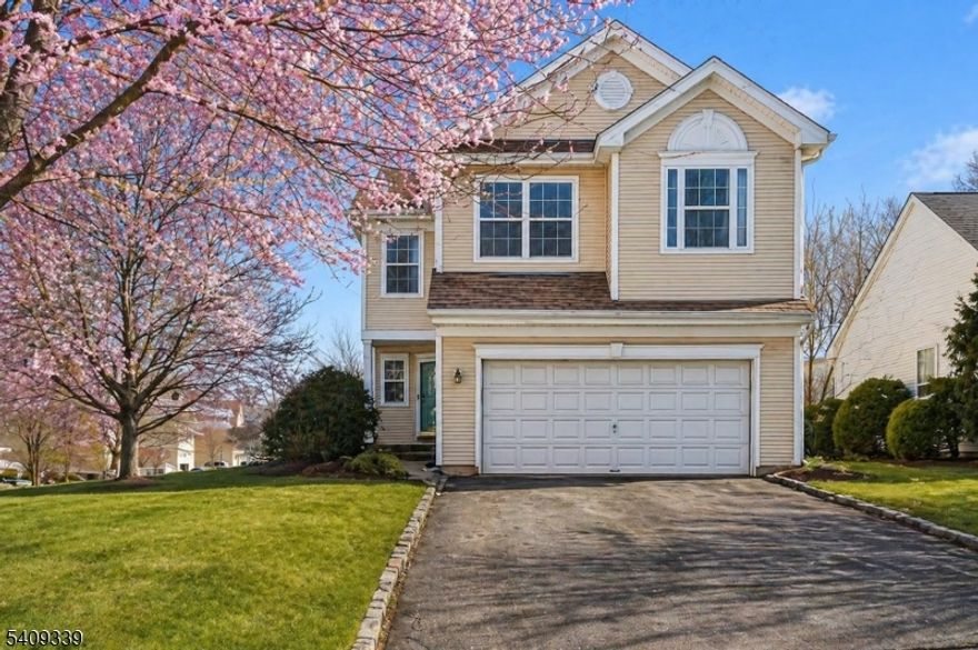 Set on a corner lot at the start of a cul-de-sac in the Lake Cushetunk community, this 4-bedroom, 2.5-bath home offers a well-balanced mix of space, natural light, and thoughtful updates. Hardwood flooring runs throughout much of the home, and many rooms have been freshly painted, creating a bright, refreshed feel.The family room serves as the central gathering space, featuring a wood burning fireplace and an easy flow into the kitchen and dining areas, ideal for everyday living and entertaining. Large windows throughout the home bring in abundant natural light, enhancing the open feel of the living spaces. The fully finished basement adds valuable flexibility for whatever fits your needs. The primary suite is a standout, featuring cathedral ceilings and oversized windows. The updated primary bathroom includes modern finishes, and custom closet shelving provides smart, organized storage. Additional bedrooms offer comfortable proportions and versatility for a variety of needs.Outdoor living is extended by a deck with awning, creating a comfortable setting for dining or relaxing during warmer months.Lake Cushetunk is appreciated for its scenic surroundings, with nearby access to walking paths. This community offers a peaceful backdrop while remaining close to daily conveniences.Conveniently located minutes from Routes 22, 287, and 78, the Whitehouse train station, and a wide range of shopping and dining options, this home offers both accessibility and a connected lifestyle.