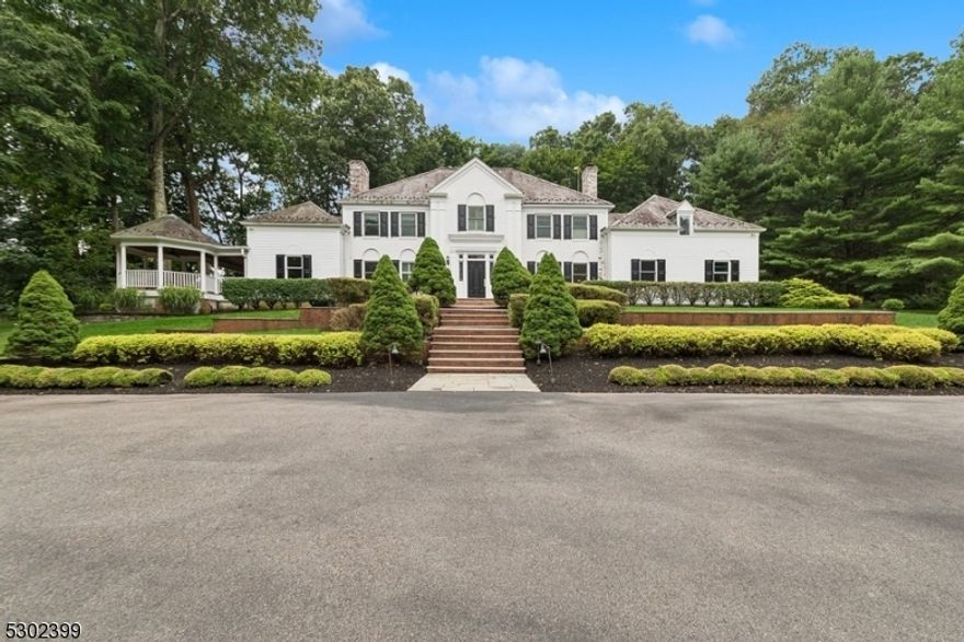 Discover the charm of the Woodfall House, a Georgian-style Colonial with a classic brick and clapboard facade and a Vermont slate roof nestled on 5.5 acres. This home seamlessly blends historical elegance with modern comfort featuring 5 bedrooms and 4.1 baths. The gourmet Canterbury kitchen, equipped with Viking appliances and elegant finishes, is perfect for any culinary enthusiast. Luxurious baths include a primary suite with a marble bathroom featuring a soaking tub and rain shower.  Entertaining is a delight with the expansive mahogany wraparound porch with ceiling fans, a Viking gas grill, a 2000-bottle wine cellar, and GENERATOR. The elegant primary suite offers walk-in closets, a sitting room, and a private sun deck. Convenience and security are ensured with a parking court surrounded by brick walls and beautiful landscape gardens with deer fencing. Experience the perfect blend of historic charm and modern luxury at Woodfall House. Schedule a private tour today