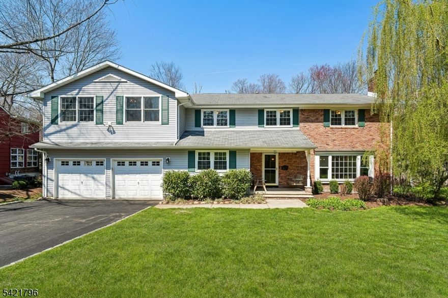 Exceptional space in this move in ready Colonial in the coveted Spring Ridge neighborhood.  So much to love!  5 bedrooms all on the second floor with a beautiful primary suite with sitting room, large primary bath and walk in closet.  The first floor includes living room, dining room, family room, home office, laundry room and great eat in kitchen.  Large screened porch off the back opens to deck and lovely wooded views.  The lower level includes a 4th full bath, recreation room, exercise room and storage. All of this plus 2026 newly refinished hardwood floors and fresh interior paint! Multi zone CAC and forced air heating, 2024 new hot water heaters, 2025 newly paved driveway, home generator.  Oversized two car attached garage and private rear yard open to wooded park land.   Great location convenient to schools and town.  Not to be missed!