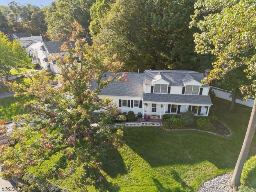 Fabulous and spacious immaculately maintained 4 Bedroom Colonial with 4 Full Bathrooms including 1st floor Primary Suite in ideal and convenient location! Nestled on a quiet cul de sac in the heart of the Glenwood section a few short blocks to top rated Glenwood Elementary School, the Short Hills Train Station and 16-acre Cora Hartshorn Arboretum. The home features level park-like property, lovely outdoor entertaining spaces and terrific flow. Foyer flanked by the Formal Living Room and 1st floor Home Office / Guest Room. Sun-drenched Living Room flows seamlessly to Formal Dining Room. Stunning 4-years young Eat-In Kitchen boasts custom cabinetry, granite counters,and glass French sliders with direct access to the maintenance-free Trex Deck. Rounding out the spacious first floor is a full hallway Bathroom + a dreamy Primary Suite with luxurious Primary Bathroom. Open staircase leads to 2nd level with large landing with access to oversized walk-in attic for potential expansion, 3 roomy bedrooms and an updated full bathroom. Spacious Lower Level with Rec Room, oversized Laundry, wine cellar and storage rooms with direct access from the mudroom to the attached 2-car garage. Pristine yard is lush and private with plenty of room for sports and gatherings. This extraordinary home is turnkey ready for the Short Hills buyer seeking an updated home in the ultimate convenient neighborhood near transportation, schools, shopping and downtown!