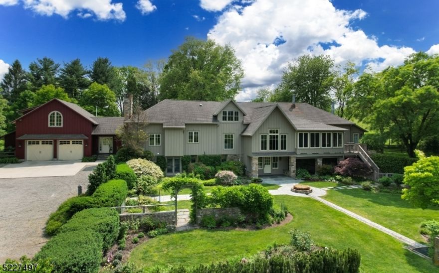 Beautiful views over gardens and fields extend from this peaceful home which began its life as a stone calving barn at the turn of the century. The main residence was rebuilt and expanded in 2018 and offers a spacious open floor plan filled with natural light and plenty of private spaces to use as needed. There is a gate house with 2 legal rentals : a 2BR unit and 4BR unit ( being sold as is), a spacious 2 story Kistler barn that is heated and ideal for cars or animals. A charming sheep barn with water & electric adorns the front field. Sited on 24 +/- acres of farm-assessed and farm preserved land in Mendham Twp, the bucolic property enjoys vegetable and flower gardens, meadows and open fields with walking paths that extend across the neighboring farms. The 15-room main house offers 5,000 + square feet of flexible space: four bedrooms (with the primary suite on the main level), 3 full baths, 2 powder rooms, a fabulous chefs kitchen, a spacious great room w/ lounge area, a gracious dining room, sun room, 2 offices / studios, a den / media room, dog room w/ electronic door to a pen, a screened porch and an attached oversized 2 car garage w/ a heated entry pad. A private drive leads beyond the gated entry, past the barn, to the front parking court. The property is enhanced by professional landscaping and hardscaping, a unique mill stone water feature in the front garden, multiple bluestone terraces, stone walls and specimen trees.