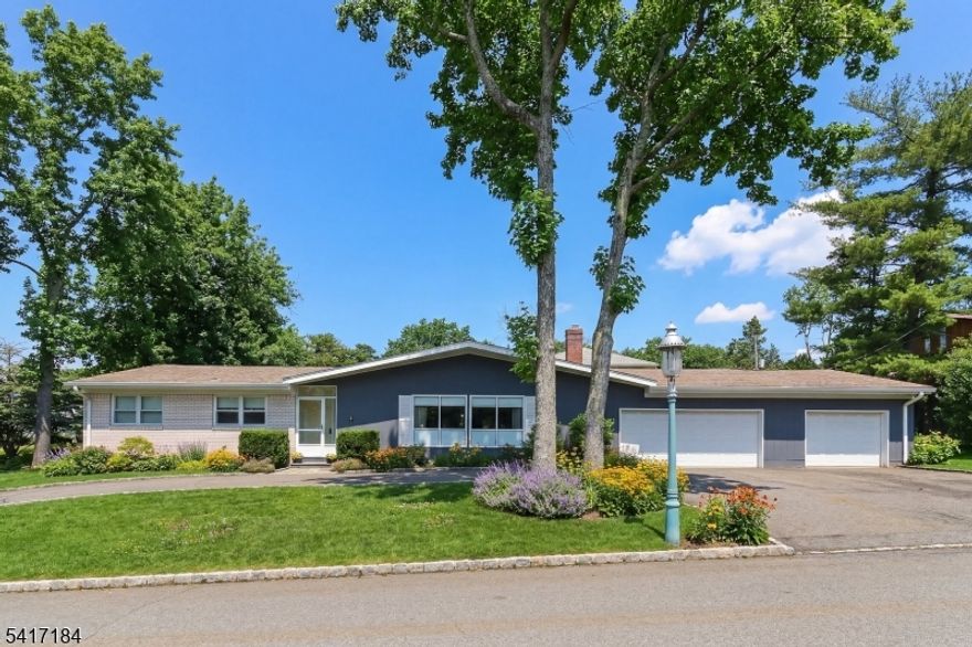 Set on a corner lot along a quiet, well-kept street, this 3-bedroom, 2-bath ranch offers space, flexibility, and an excellent opportunity to make it your own. The expansive backyard and concrete patio provide plenty of room for outdoor entertaining, gardening, or simply relaxing in a peaceful setting. Inside, generously sized rooms create a comfortable layout with great flow for everyday living. The primary suite features a recently updated bath and exceptional storage, including a walk-in closet plus three additional closets. Two additional bedrooms offer versatility for guests, work-from-home needs, or hobbies. This home has been well maintained, with a newer roof (2013) and central air updated within the past 10 years. A circular paved driveway and rare 3-car garage add both convenience and functionality. Built in 1968 and serviced by city water and sewer, this all-electric home is a true blank canvas, ready for your personal style and updates to bring it to its full potential. Ideally located close to South Orange and Mountain train stations, as well as local restaurants and shopping, this property combines a great neighborhood setting with commuter-friendly convenience. A solid home with great bones and endless possibilities.