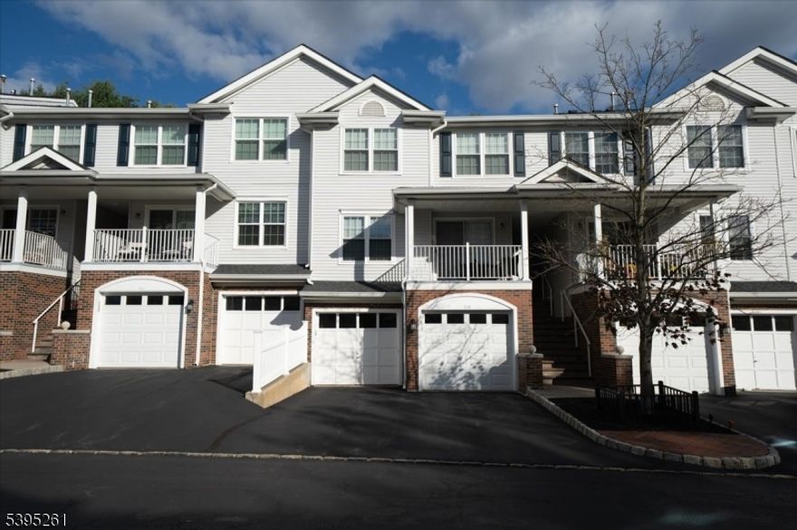 BRIGHT, LIGHT, AND BEAUTIFUL TOWNHOME in highly desirable Berkshire Hills!! You will be welcomed by an open-concept first floor featuring a living room with a sliding door to a patio, kitchen with white cabinets, backsplash, and stainless steel appliances, dining room, laundry room ,and powder room.  Second floor offers a large primary bedroom with a walk-in closet and full bathroom, a second bedroom and a main bath.  A partial basement will give you lots of additional storage space.  This great community provides swimming pool and a playground.  A convenient location in proximity to shopping and highways will make your life easy. Come and fall in love with your new home!