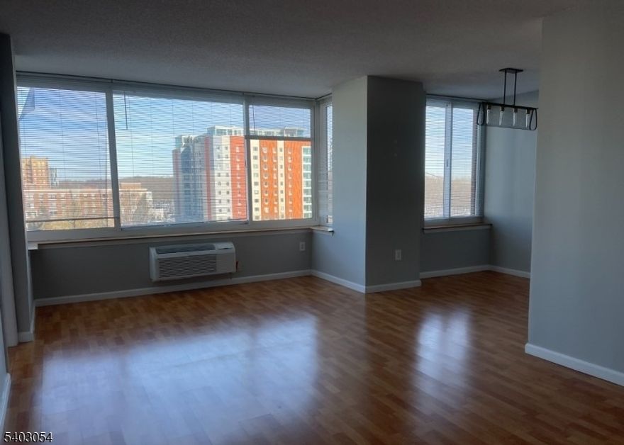 AVAILABLE MARCH 1, 2026.  LUXURIOUS HIGH RISE CONDOMINUM located in the PRESTIGIOUS and desirable community of OLD PALISDE with BRIDGE VIEWS.  Versatile, magnificent, updated and open MODERN corner unit with abundant sun filled windows.  This home features neutral colors, master bedroom with a walk in closet and third bedroom that can be used as a home office.   Kitchen features SS appliances, white cabinetry and granite countertops.  Laundry inside the unit.  TWO assigned garage parking spaces.  NYC commuter convenient!  There is a $500 move-in fee and $500 move-out security deposit that is refundable.