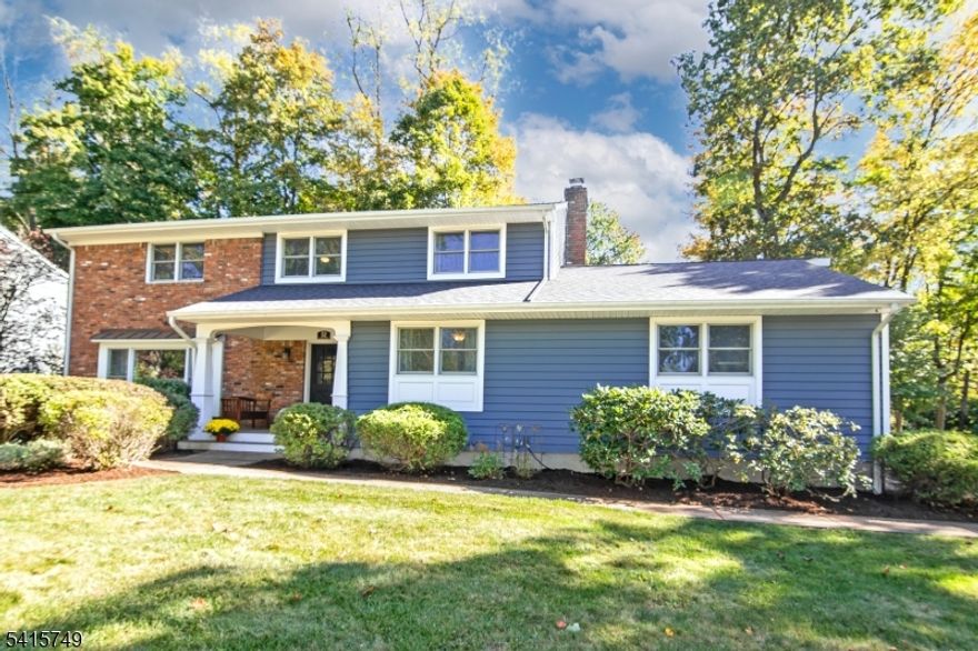 Spring Ridge New Listing! On a spacious, level property in one of the most desirable neighborhoods, this recently updated home is filled with warmth and offers an ideal blend of comfort, functionality, and timeless style.The heart of the home is the gourmet eat-in kitchen, featuring custom cabinetry, quartz countertops, high-end stainless steel appliances, and a double convection wall oven. French doors lead to the deck and patio, creating an effortless flow for everyday living and outdoor entertaining. The kitchen opens seamlessly to the family room with a fireplace, while the first floor also includes a sun-filled living room, a formal dining room with detailed molding, a powder room, and a first-floor bedroom or office.Upstairs, the spacious primary suite offers a peaceful retreat with a walk-in closet and a renovated en-suite bath. Additional bedrooms are well proportioned and share a beautifully updated hall bath. The full basement provides exceptional flexibility for recreation, a home office, wine room, fitness area, full bath, laundry, and abundant storage.Additional highlights include hardwood flooring throughout, custom millwork, newer windows, a spacious laundry room, and a 2016 kitchen and family room expansion. The attached two-car garage, deck overlooking the expansive backyard, built-in shed, and beautifully landscaped property further enhance the home's appeal.  Berkeley Heights offers TOP SCHOOLS, a convenient commute and expansive recreation faciliities.