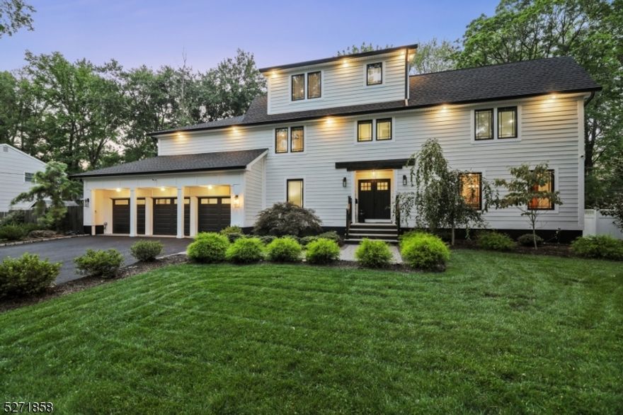 Welcome to this stunning CUSTOM center hall colonial home, where timeless elegance meets modern luxury.This remarkable property, with its total gut renovation and addition completed in 2021, is a true masterpiece of craftsmanship and design. Located in a highly sought-after neighborhood, this home boasts 7 bedrooms, 5 bathrooms and a spacious 3-car garage. Upon entering, you'll immediately be captivated by the meticulous attention to detail and high-end finishes. Hardwood floors throughout the home create an inviting and warm atmosphere. The heart of the home is the eat-in kitchen, a chef's dream with quartz countertops, a stylish tile backsplash, under-cabinet lighting and a center island breakfast bar. The primary suite is a sanctuary of sophistication, featuring an ensuite bath with new steam shower & custom walk-in closet, ensuring that every day begins and ends in luxurious comfort. The 3rd floor includes two more bedrooms & another full bath. The finished lower level offers a spacious recreation room. The exterior features a fenced-in yard, lovely vegetable garden, deck & paver patio - ideal for outdoor dining, relaxation and entertaining. This amazing home also features everything NEW in 2021 including HardiePlank siding, multi-zone HVAC, roof, electric & plumbing, floors, Andersen windows, doors, baths, whole house generator, exterior lighting & many smart home features. Conveniently located to top-rated schools, shopping, parks, NYC transportation & major highways.