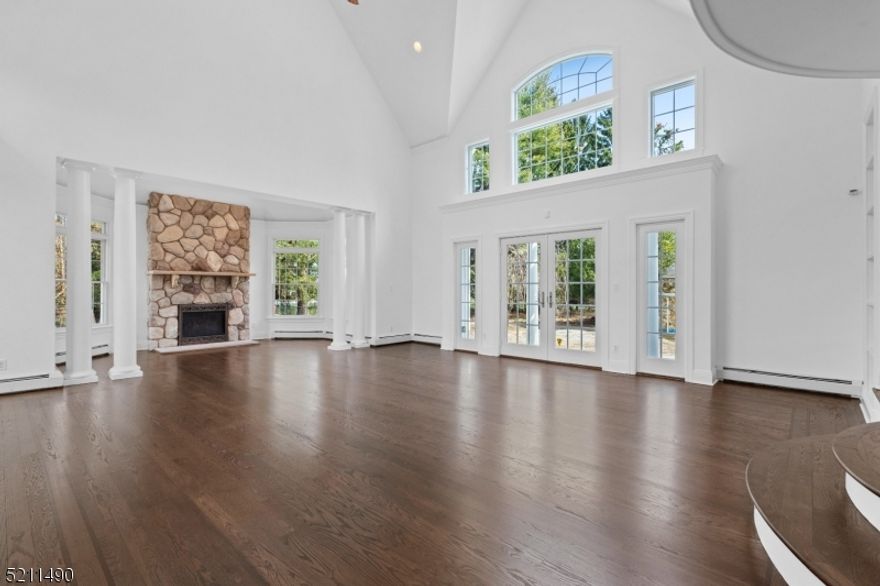 Ideally located and much larger than it appears sits this 7432 sq ft colonial nestled upon 1.49 acres. Well-constructed with the most sought-after materials and amenities, this home is built to entertain or accommodate a multi-generational lifestyle. The octagonal FDR is steps away from the 2 story LR w/ masonry wood fireplace that opens to the backyard. The MEIK w/ custom cabinets, granite tops & new SS appliances opens to the paver patio & tranquil backyard. The den leads to the sunlit indoor pool w/ whirlpool & fireplace. Life can't be easier with a first floor ensuite, office, bonus room, laundry room & mudroom. The upper level with 5 bedrooms, ensuite & 3 full baths has an exquisite primary bedroom with tray ceiling, stunning primary bath along with 2 walk-in closets & a balcony overlooking the LR. The basement has a large finished room along with a potential theatre room and half bath. Utility & storage rooms complete the lower level. Make this exquisite home yours to enjoy!