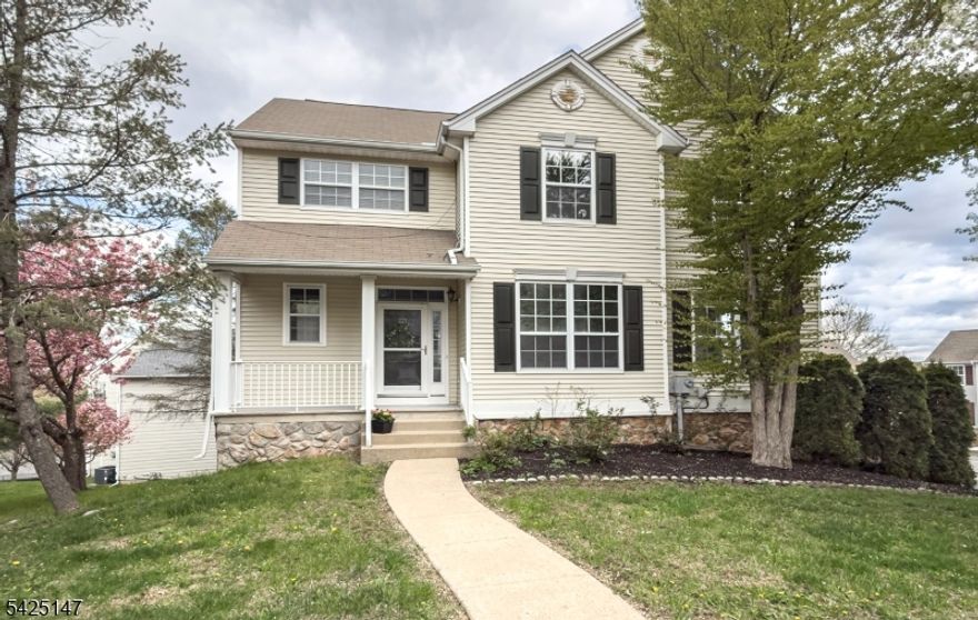 Welcome to this beautiful Ashwood model home with thoughtful updates in the highly sought after Woodfield Estates community.  Filled with natural light, this home features a spacious formal living room and dining room combination, perfect for entertaining.  The updated kitchen boasts brand new stainless steel appliances, a bright breakfast area with sliding doors to the deck and flows seamlessly into a warm and inviting family room with a cozy gas fireplace.  Upstairs, the primary suite offers a private ensuite bath complimented by three additional bedrooms and full main bathroom.  Stylish luxury vinyl flooring runs throughout both levels adding durability and modern appeal.  The finished walkout basement provides versatile space ideal for a home office, gym or media room.  Additional highlights include a two car garage and access to exceptional community amenities including a pool, tennis and basketball courts and playgrounds.  This move in ready home combines comfort, style and convenience...don't miss the opportunity to make it yours! Primary Closet Doors being installed.