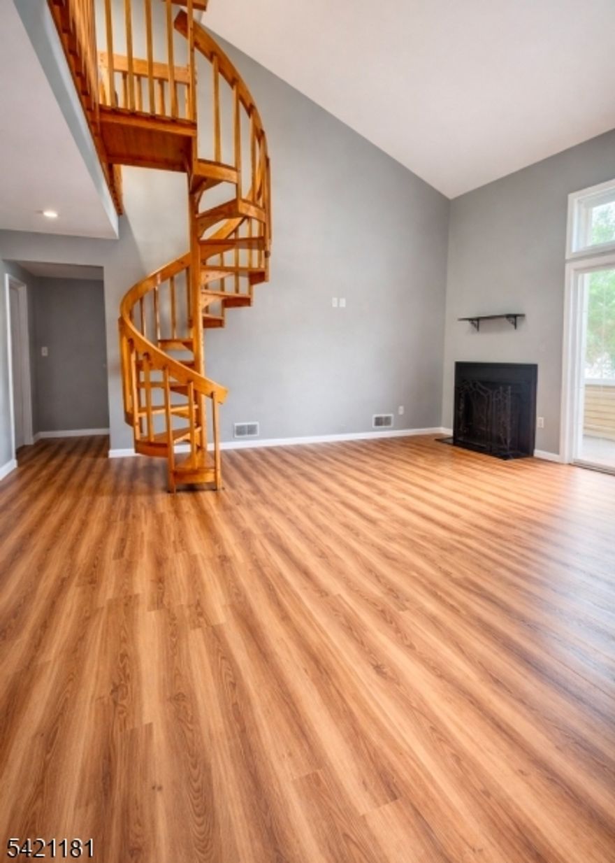 Move right into this recently renovated two bed, two bath loft with a private balcony located in sought after The Pointe at Galloping Hill. Come to where comfort and convenience comes together. Walk right into your sun filled foyer with coat closet that leads up to your open floor layout featuring the living/dining room. Beautiful floors throughout. Kitchen features stainless steel appliances and tons of cabinets. Primary bedroom on the first floor offers a walk in closet and full bathroom. Relax around the wood burning fireplace or open the sliders off of the living room to entertain. Upstairs offers a spacious loft which has two large closets and a full second bath. This space makes a great second bedroom, guest room or office, whatever you'd like! Beautiful floors throughout as well as an in unit stackable washer and dryer. Seasonal in-ground pool and clubhouse. Condo being sold as is. Photos taken when condo was vacant.