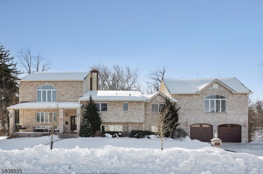 A LIFESTYLE AWAITS! Situated on .822 acres this stunning 6-bedroom, 4.5-bath residence offers exceptional space, comfort, and luxury in one of Westfield's most sought-after neighborhoods. Thoughtfully designed and meticulously maintained, this home delivers the perfect balance of elegance and functionality. Radiant-heated floor provides year-round comfort, complemented by expansive living and entertaining spaces filled with natural light. Gourmet eat in kitchen with SS appliances and 12' granite island. family Room with gas fireplace and wet bar. Finished basement, ideal for a recreation room, media space, home gym, or guest accommodations, offering endless flexibility to suit your lifestyle. Oversized heated garage adds both convenience and practicality, perfect for car enthusiasts or additional storage needs. Step outside to your own private resort-style backyard, designed for both relaxation and entertaining. Highlights include a heated inground salt water pool with spa, custom fire pit, built-in gas grill, pizza oven, beverage refrigerator, sink and multiple areas for outdoor dining and gathering - an entertainer's dream. This versatile floor plan accommodates guests. Located near Westfield's top-rated schools, vibrant downtown, parks, and NYC transportation, this extraordinary property offers luxury living with everyday convenience.