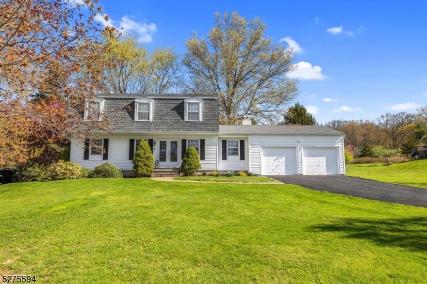 Colonial in Quail Ridge with miles of sidewalks, public utilities and beautiful scenery!  Beautiful corner lot with newly paved driveway and paver walkways.  Step into the foyer and notice the details - crown and chair moldings, fresh paint, two fully updated baths, eat-in kitchen updated, new carpeting, family room with full wall brick fireplace, 4 spacious bedrooms, primary bedroom with walk-in closet, baseboard hot water natural gas heat, close to Flocktown/Kossman Schools.  Built-in automatic generator, 2 car garage, storage shed and more.  Minutes to Rts. 46 and 80, Long Valley Schools and West Morris Central High School with IB Program. *4th bedroom currently has washer and dryer in closet -Seller will move them back to basement if buyer chooses.