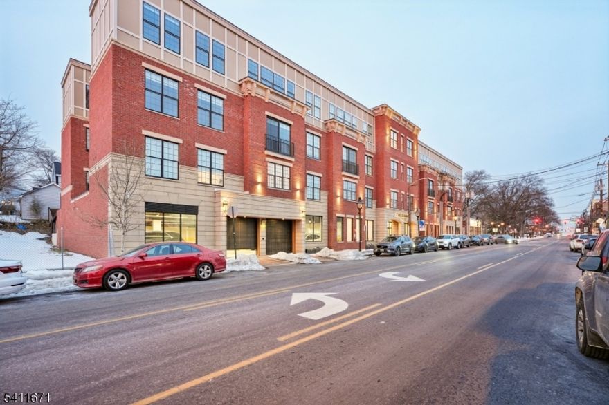 This beautifully designed 2-bedroom, 2-bath home combines clean modern style with everyday comfort in one of Maplewood?s most convenient locations.The heart of the residence is a dramatic oversized waterfall-edge kitchen island finished in striking Calacatta-inspired quartz. Custom soft-close cabinetry, exterior-vented cooking, and a full stainless appliance package ? including a refrigerator with ice and water ? make the space equally suited for entertaining or a quiet night in.Tall ceilings, oversized European windows and wide sliding glass doors fill the living space with natural light and create an open, airy feel throughout. The layout flows effortlessly from kitchen to living area, with access to private outdoor space for morning coffee or evening unwinding.The primary suite offers generous closet space and a spa-style bath with a custom vanity and glass-enclosed shower. A second full bathroom and bedroom provide flexibility for guests, a home office, or both. Additional highlights include solid wood interior doors, sleek modern hardware, recessed lighting, keyless entry, and a full-size in-unit washer and dryer.Residents enjoy concierge service, a fitness center, lounge space, indoor heated garage parking with EV charging, and dedicated storage and bike areas.Located just moments from Maplewood Village, parks, dining, coffee shops, and the NYC train, this home offers the perfect balance of neighborhood charm and city accessibility.
