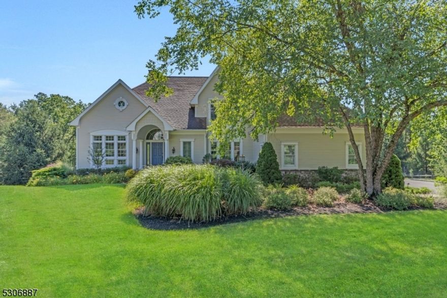This exquisite custom colonial home located in Basking Ridge is nestled in a serene cul-de-sac on a sprawling 2.6 acre lot offering both privacy and elegance. This residence features four spacious bedrooms and 3 1/2 bathrooms complemented by beautiful hardwood floors throughout.  The heart of the home is a chefs kitchen designed for culinary excellence with stainless steel appliances and ample counter space.  Spanning three finished levels, this home provides versatile living areas and an abundant space for entertaining. Outside you'll find a stunning Gunite pool with an exquisite poolscape perfect for relaxation and outdoor gatherings. The three car garage adds convenience and additional storage to this exceptional property.