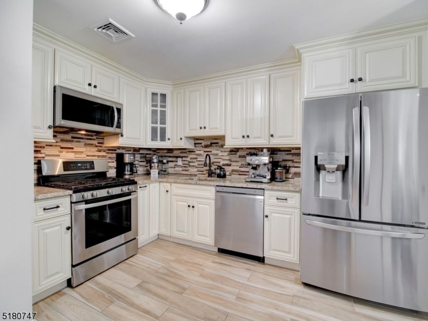 DESIRABLE WILLOW WALK COMPLEX, THIS BEAUTIFULLY UPDATED 2 BEDROOM, 2.5 BATH TOWNHOME IS READY FOR ITS NEXT HOMEOWNERS. UPDATED EAT-IN KITCHEN FEATURES BEAUTIFUL CABINETRY, GRANITE COUNTERTOPS & STAINLESS STEEL APPLIANCES. THIS UNIT ALSO FEATURES A DINING ROOM, SPACIOUS TWO STORY LIVING ROOM WITH VAULTED CEILING W SKYLIGHT  & SLIDERS TO BALCONY.  PRIMARY BEDROOM HAS LARGE WALK IN CLOSET AND FULL BATH WITH UPDATED DUAL VANITY, SEPARATE SHOWER & SOAKING TUB. FOR ADDED CONVENIENCE, THE LAUNDRY ROOM IS LOCATED ON THE MAIN LEVEL.  OTHER SPECIAL FEATURES INCLUDE SOME WOOD FLOORS ON FIRST LEVEL, EX-LARGE 2ND BEDROOM & LOFT ON TOP FLOOR,  NEST THERMOSTAT SYSTEM, NEWER HOT WATER HEATER, CEILING FANS & PUBLIC UTILITIES. ONE CAR GARAGE ENTERS UNIT AT FOYER WITH LARGE CLOSET. GUEST PARKING & PLAYGROUND LOCATED DIRECTLY ACROSS THE STREET. COMMUNITY AMENITIES INCLUDE CLUBHOUSE, POOL, TENNIS COURTS, WALKING PATHS & MORE. COMMUTERS DREAM- CLOSE TO MAJOR HWYS 80/46/10 & NYC TRAIN AND BUS STOPS. CONVENIENT TO VARIOUS SHOPPING CENTERS, RESTAURANTS, TOWN & COUNTY PARKS, AND SO MUCH MORE.