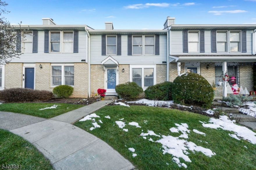 Welcome to this move-in ready townhouse offering comfort, space, and convenience. This home features 2 bedrooms, 2.5 bathrooms, and a partially finished basement providing flexible additional living space, plus a separate laundry and utility room. The main level offers newer laminate flooring, a convenient powder room, a bright eat-in kitchen, and a sun-filled living room with sliding doors to a private deck overlooking a peaceful wooded yard. Upstairs, both generously sized bedrooms include private bathrooms, creating an ideal layout and functionality. Residents enjoy community amenities such as an inground pool, basketball courts and a club house, all while being close to shopping, dining, schools, major roadways, and outdoor recreation. Move right in and enjoy easy, low-maintenance living in a peaceful and convenient location you will love to call home.