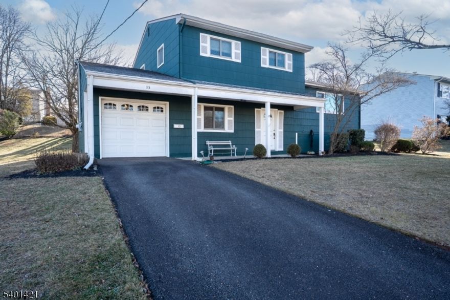 This multi-level home with a covered front porch is located in a lovely neighborhood in Franklin Township.  It offers four bedrooms, one full and two half bathrooms. On the first level one will enter into a spacious foyer to find the family room with sliding-glass doors leading to the patio and backyard; bedroom; powder room with a pedestal sink; and access to the one-car garage. Up a short flight of stairs is the main living level with a renovated eat-in kitchen featuring maple cabinetry, stainless steel appliances, drop-in range, wall oven, granite counters, and access to the backyard and deck. Off of the kitchen is a formal dining room which is open to the living room.  Up an additional short flight of stairs, you will find the primary bedroom with en suite half bathroom. There are two additional bedrooms and the main bathroom. All three bedrooms on this level have hardwood flooring. In addition, there is a partial basement with laundry, and big backyard landscaping and a deck off the rear of the home.Only minutes away from parks, local schools, restaurants, shops Close to major highways near to bus line for commuting to NYC!
