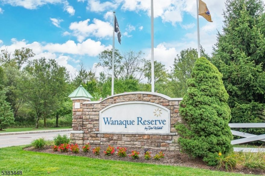 MOTIVATED SELLER! Welcome to the newest building in Wanaque Reserve, built in 2012! This beautiful 2-bedroom, 2-bath, first-floor condo is located in a premier 55+ gated community with 24-hour security. The home features a spacious eat-in kitchen with granite counters, stainless steel appliances, backsplash, pantry and a conveniently located laundry room. Enjoy a large living room with sliders to a private balcony, a formal dining room perfect for gatherings, a versatile den with French doors. One assigned garage space plus additional outdoor parking included. Upgrades include crown molding, tray ceilings, chair rail, detailed trim work, and elegant foyer pillars. Wanaque Reserve offers an unmatched lifestyle with a state-of-the-art clubhouse and cafe, indoor and outdoor pools, fitness center, theatre, ballroom, art studio, billiards room, saunas, and hot tub. Outdoor amenities include tennis, bocce, shuffleboard, and walking paths.With over 40 clubs and activities Travel Club, Wine Club, Pickleball, Bocce, and more there's something for everyone. HOA covers water & sewer. Wanaque Reserve offers residents a safe, active, and social community to enjoy while leaving behind the responsibilities of a single-family home.