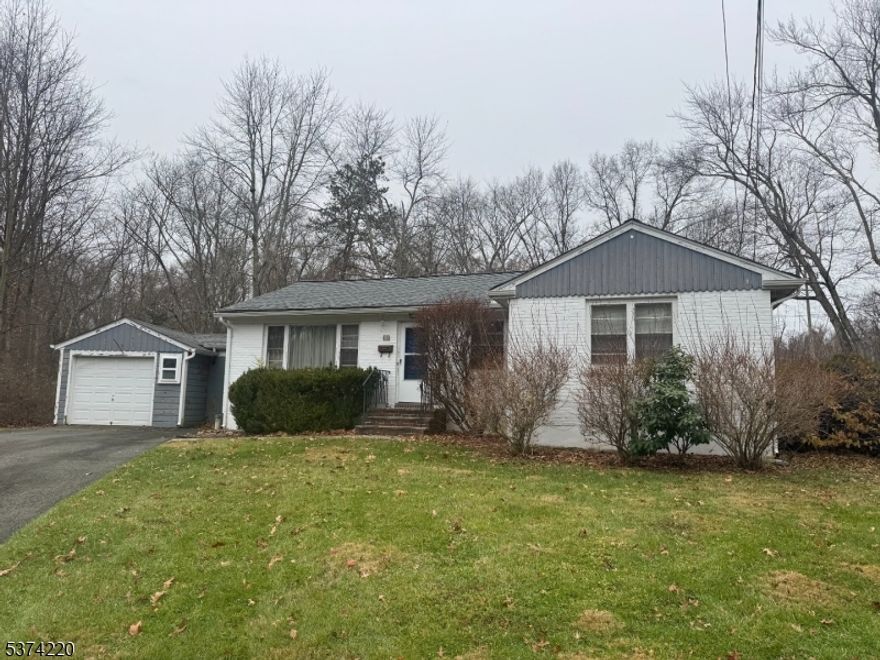 Welcome home to this charming 3-bedroom, 1-bathroom Ranch, ideally situated on a quiet cul-de-sac. Step inside to find a spacious living room that invites conversation and relaxation, seamlessly connected to the dining room an ideal space for intimate meals or entertaining guests. The kitchen offers a blank canvas, ready for your personal touch and vision. The primary bedroom features a generously sized closet and serves as your private retreat, while two additional bedrooms and a full bathroom complete the main level. The full, partially finished basement expands your possibilities with a family room, laundry area, and utility space perfect for bonus living or storage. Outside, the generous wooded lot provides a peaceful backdrop for outdoor enjoyment and recreation. An attached 1-car garage and ample driveway parking add everyday convenience. With its solid layout and prime location near shopping, dining, parks, and more, this home presents an incredible opportunity to create the space you've always imagined.