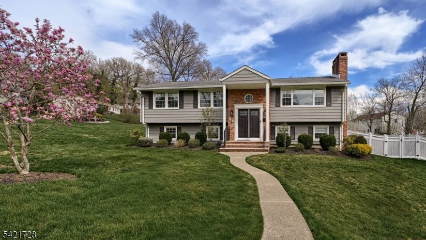 Modern elegance meets thoughtful design in this expanded custom Bi-Level offering approx 3,625 sq ft of beautifully appointed living space w/ 5 Bedrooms & 4 full Baths. The main level welcomes you w/ a sun-filled Great Rm featuring a wood-burning fireplace, seamlessly flowing into a formal Dining Rm & a sleek, modern white Kitchen embellished w/ a farmhouse sink, center island, quartz countertops, & stainless steel appliances perfect for both everyday living & entertaining. A stunning Primary Suite addition Boasts a designer en-suite bath & two oversized fitted walk-in closets. This level also includes three additional Bedrooms, full bath, and a main hall bath, & hardwood floors throughout. The fully finished lower level offers exceptional flexibility, ideal as a Mother/Daughter set-up or guest accommodations, featuring a spacious Bedroom, full bath, large family Rm, & a 4-season enclosed porch. Luxury vinyl flooring runs throughout this level, along w/ a tiled Laundry/Leisure Rm & access to an oversized 2-car garage w/ epoxy flooring & hot/cold water hookup. Step outside to a 36x18 covered porch complete w/ an 18-ft outdoor Kitchen & pizza oven perfect for year-round entertaining. Additional highlights include recessed lighting throughout, abundant storage & closet space, 4-zone baseboard heat, central air plus split systems, whole-house owned filtration system, UGS, generator hookup, security cameras w/ audio, Ring system, large storage shed, & 8 varieties of fruit trees.