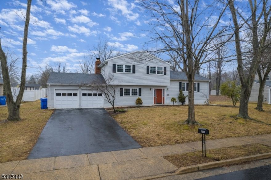Split-level home offering 4 bedrooms and 2.5 baths set on a large lot in a convenient North Brunswick location. The home features a spacious living room, dining area, and family room, providing plenty of space for everyday living and entertaining. A bright Florida/three-season room offers additional space to relax and enjoy views of the yard. The primary bedroom includes an ensuite bath with a shower stall. A fully finished basement with a recreation room provides extra living space. Enjoy outdoor living with a deck and patio overlooking the expansive backyard. Additional features include a 2-car garage and close proximity to shopping, restaurants, parks, Farrington Lake, and Routes 1 and 130.