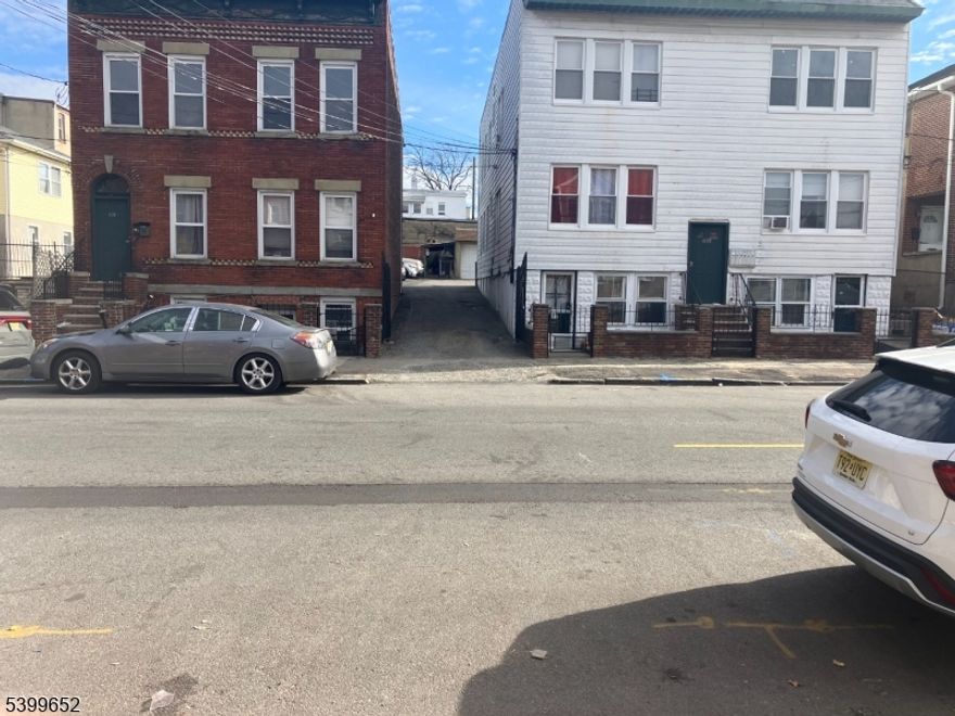 Welcome to Your Investment  or the opportunity for owner-occupants.  Charming 3 Family Home Nestled In a Desirable Location. Spacious and well appointed. Each unit consists of 2 bedrooms, 1 full Bathroom, a Living Room and eat-in Kitchen area. Each unit has separate utilities, this property offers the potential for significant rental income.  In addition, the property includes 8 fully rented parking spaces. A unique Whether you're an investor looking to capitalize on the rental market or a homeowner looking to offset your mortgage, this property presents a lucrative opportunity. Conveniently located near public transportation, schools, and stores. Sold AS" IS"