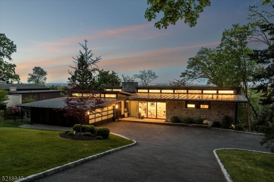 Absolute perfection is what you will find in this stunning Mid-Century Modern gem. Spectacular year-round Manhattan skyline views, floor to ceiling windows, massive 11-ft. ceilings, two-story patios and original Mid-Century details will take your breath away. House built in 1961 by prominent structural engineer August Komendant. Gut renovated in 2016, preserving the original architecture while integrating loads of modern and smart home conveniences! Kitchen and bathrooms reimagined in 2022 with meticulous attention to detail. Gorgeous kitchen w/ quartz countertop, ceramic tile backsplash and marble waterfall island flows into expansive and light-filled living and dining room w/ custom walnut banquette and statement stone fireplace. Primary suite w/ Manhattan views includes direct access to deck, walk-in closet and spa-like bath w/ custom cabinetry, deep soaking tub, heated marble floor and brass fixtures. Two more bedrooms and 1.5 baths round out the 1st floor. Lower level features 4th bedroom, office (w/ direct access to patio), workout room, full bath, flex space and generous closets. Don't miss the sophisticated but cozy family room w/ custom walnut bar and glass sliders to the large patio   perfect for entertaining! All set on over .5 acre of private and lushly landscaped property. This is TRULY a one of a kind and once in a lifetime opportunity in Montclair!