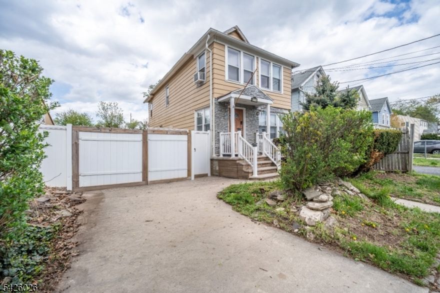 This well-maintained Colonial-style home offers a functional layout across 1,458 sq ft with 6 spacious rooms, including 3 bedrooms and 1.5 baths. The home sits on a 55x135.33 lot and features vinyl siding with a stone-accent front porch. Inside, you'll find mixed flooring throughout and an eat-in kitchen with gas cooking. A partially finished basement provides flexible space for storage, hobbies, or recreation. The property also includes a gated driveway, privacy fencing, and mature landscaping, plus exclusive driveway parking for added convenience . A great opportunity to own a classic Plainfield home with room to personalize.
