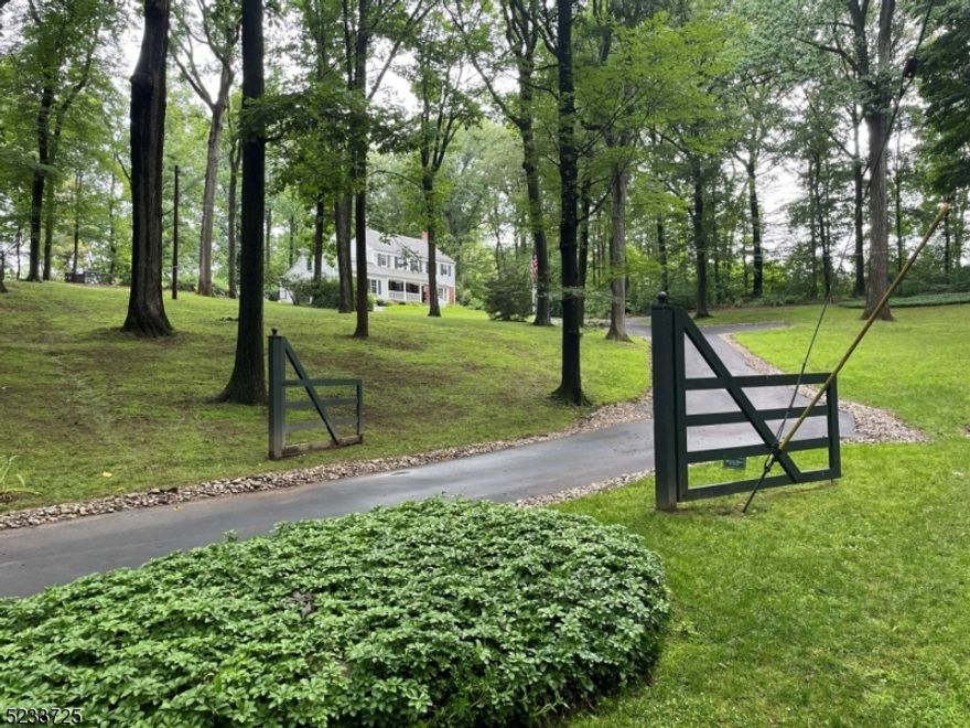 Welcome to "Four Green Fields", don't miss this rare opportunity to own a stunning 4-bedroom colonial set on a private cul-de-sac on 4-acres in sought-after Harding NJ. This home offers 3,400+ sq. ft. with 2 fireplaces, quartz kitchen countertops, water softener and Jenn-Air appliances. Enjoy outdoor amenities including: basketball court, golf driving range, 3-season barn for entertaining, two firepits and a hot tub. Additional features include finished basement with wine cellar, google mesh Wi-Fi (house & barn), reverse osmosis water filter and a whole house generator. Centrally located just minutes away from Bernardsville, Morristown, Madison, Chatham and a mere 32 minute drive from Newark airport. Brand new septic field installation scheduled for October 2023. Rare opportunity, priced to sell!