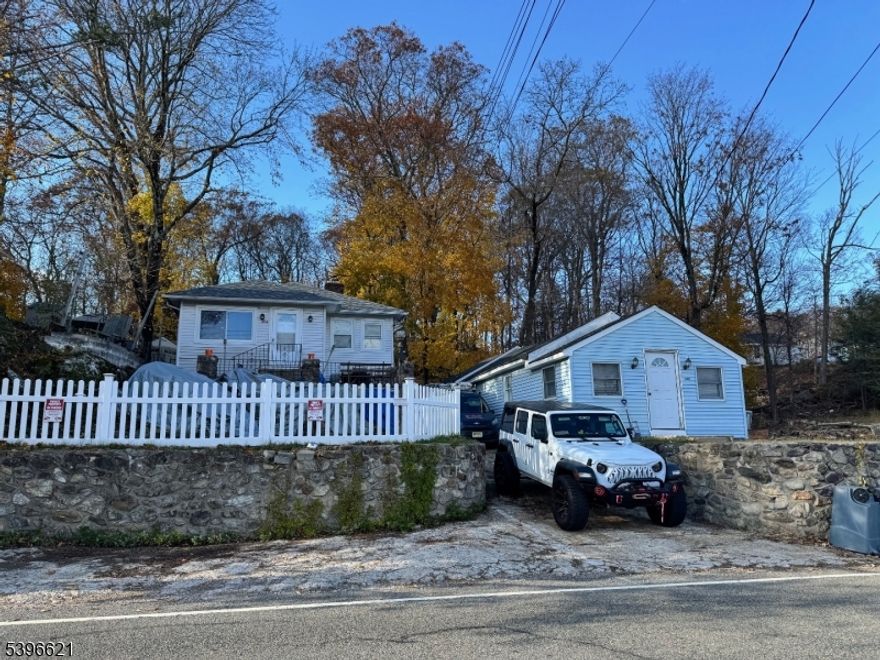 popular Northwood section of Lake Hopatcong. Live in one house and enjoy the lakeviews, while earning income from others. Renovated in 2019.  2 separate houses on one lot with beautiful lakeview. Grandfathered 2 family Main house has 2 bedrooms, greatroom with lakeview and fireplace;  kitchen opens to dining area with picture window; 1 bath. Plus a basement apartment with bedroom  combo area,  kitchen., bath.  Second house also has greatroom ;2 bedrooms; 1 bath. All have been renovated and  have excellent rental history. Fenced yard