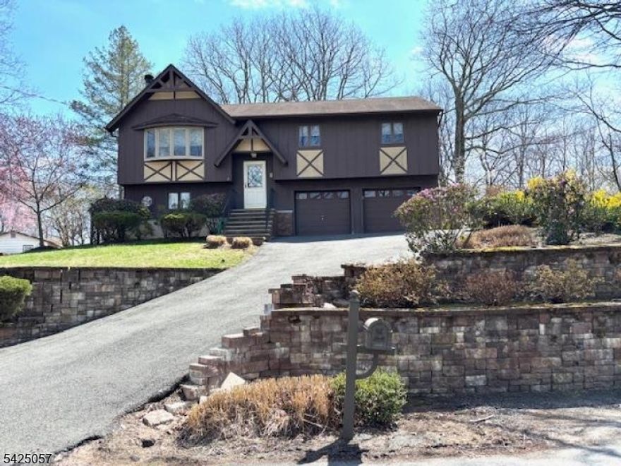 Spacious 3 bedroom 2 1/2 bath Bi-level on a quiet Cul-de-sac. Wood burning FP in Living Room and wood burning stove in Family room. Sweet loft for decorative touches.  Entertain/relax on the 2-tiered deck with a hot tub (hidden TV closet) overlooking beautiful private backyard. Family room recently renovated. 2 car garage. Close to shopping LAKE HOPATCONG OFFERS YEAR ROUND FUN...BOATING, FISHING, SWIMMING, WATER SKIING, ICE SKATING, ICE FISHING, RESTAURANTS, PARKS AND SO MUCH MORE!!! CONVENIENT TO ROUTES 46,10,80 AND NYC TRAIN/TRANSIT.
