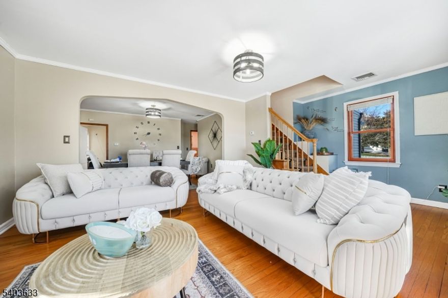 Welcome to North Haledon! Brand new furnace, brand new hot water heater and just one year old roof. This lovely single family home offering 3 bedrooms and 2 baths, perfectly blending comfort and style. The first floor features an inviting 3 season porch, a formal dining room and spacious living room. Two generously sized bedrooms, a full bath and an eat in kitchen complete the first floor. The kitchen boasts sliding doors that open to a nice size deck overlooking the yard. Upstairs, you?ll find a stunning primary bedroom suite with a full bath, a very large closet, and a cozy private balcony with sweeping views of the New York City skyline?your own peaceful retreat. Beautiful hardwood floors throughout the entire home. The basement is partially finished with a bonus room and laundry room, storage area also available. The property also includes a full shed like a separate dwelling?ideal for a home gym, studio, or workspace. A perfect blend of comfort, character, and outdoor enjoyment!