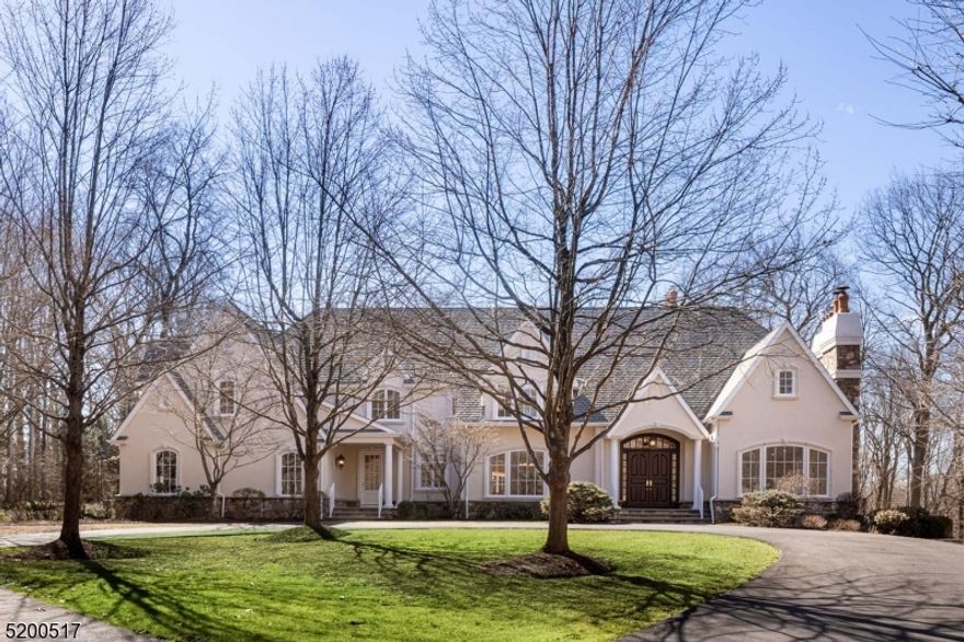 Privately set in a sought after neighborhood, this beautiful custom home checks virtually every box for comfortable living. Set at the end of a cul-de-sac, approx. 8 lush acres of open lawns, woodland, & specimen plantings provide the home's stage. Indoors bountiful light arrives from walls of windows, select window banks measure up to 11' wide. Gracious features of the almost 8000 SF residence include architecturally detailed well-proportioned spaces, hardwood floors, frequent arched passages, 5 fpls, 3 levels of high ceilings. Six Bedrooms including a first floor BR and full Bath. Double height Great Rm w/ ceiling height limestone fpl, wet bar, full wall view to rear grounds w/balustrade framed bluestone terrace, paver terrace w/ barbecue and hot tub. Living Rm w/ fpl, Dining Rm w/ coffered ceiling, each w/ wide arched entries from the 2-story Foyer. Paneled Library w/ built-ins. Sunroom. Kitchen w/ light-hued cabinetry, granite-topped 11+ ft island and quality appliances. Large window filled informal dining area. Also, main floor Office; Butler's Pantry; Mud, Laundry, & Storage Rms. Upstairs Primary Suite enjoys its own wing; luxurious BR, Bath, large walk-in closet. Plus, 2 en suites, 2 BRs sharing bath, Bonus Rm & large Storage Rm. Walk-up stairwell to attic.Unfinished, walk-out, daylight lower level allowing for high ceilings. Present are stone fireplace, multiple windows, French doors opening to patio, plumbing for bath & staircase to 3.5-bay Garage with epoxied floor.