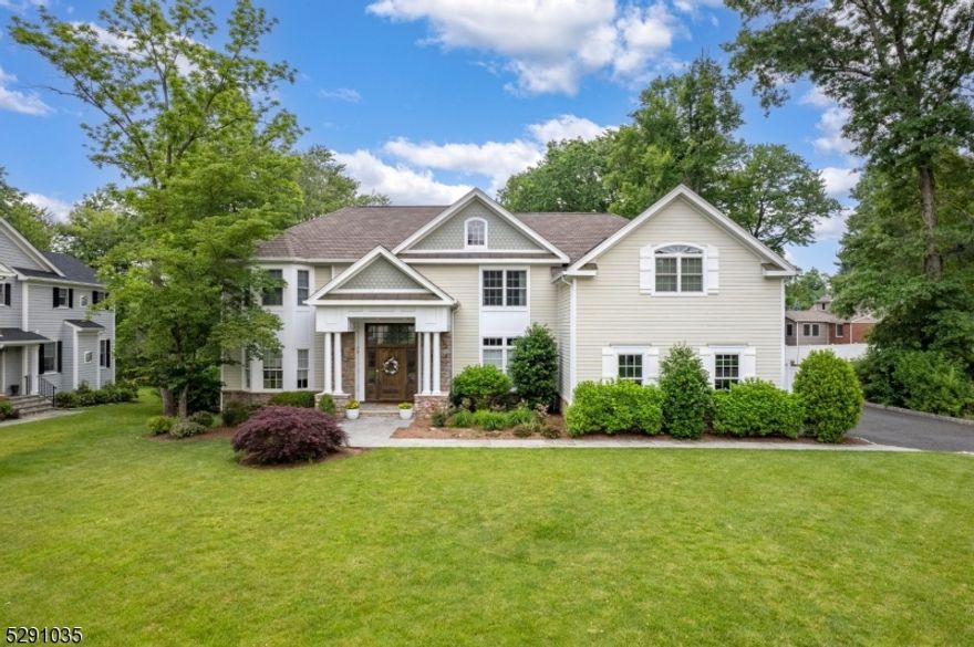 Welcome to this stunning 5 bed, 5.1 bath home set on almost half an acre in a sought after cul-de-sac adjacent to Southern Boulevard Elementary. The 1st floor features a grand foyer adorned with double-height ceilings, a formal dining room with wainscoting and coffered ceilings, a bright and airy living room, newly updated powder room, first floor guest suite/office adjacent to full bath, and convenient mudroom with direct access to 3 car garage. The heart of the home is the recently renovated eat-in kitchen, a chef's haven equipped with stainless steel appliances, center island, new fridge, new countertops, and a tile backsplash. The kitchen opens to a large family room with built-ins and a gas fireplace. Sliders off kitchen allow access to the spacious deck overlooking the expansive, level backyard. Upstairs, discover four generously sized bedrooms and 3 baths, including a luxurious primary suite boasting soaring ceilings, exposed wood beam detailing, dual walk-in closets, a private office and a spa-like en-suite bath with a glass-enclosed shower and double vanity. Convenient 2nd floor laundry. A finished lower level with a large recreation room and full bath completes this home, offering a versatile space for recreation and relaxation. Designer finishes, open floor plan, extensive millwork, refinished hardwood flooring, freshly painted interior, new HVAC unit, and so much more. Close proximity to both downtown Chatham and Madison and easy access to NYC. A must see!