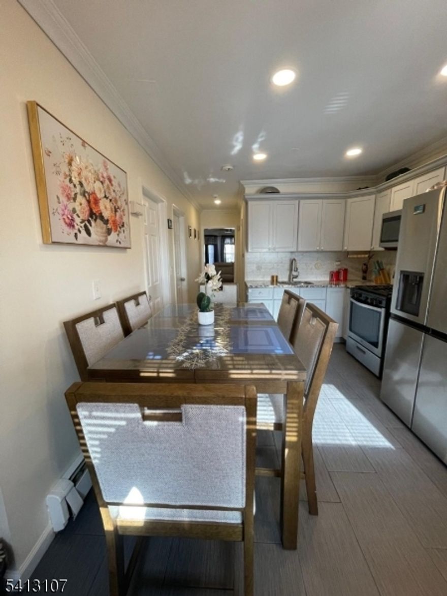 Nice two family house complete renovated from the ground up , Living room. Two bed rooms eat in Kitchen and bathroom in each floor . Finished attic with full bathroom , finished basement with full bathroom. Nice back yard with green house and summer entertainment.