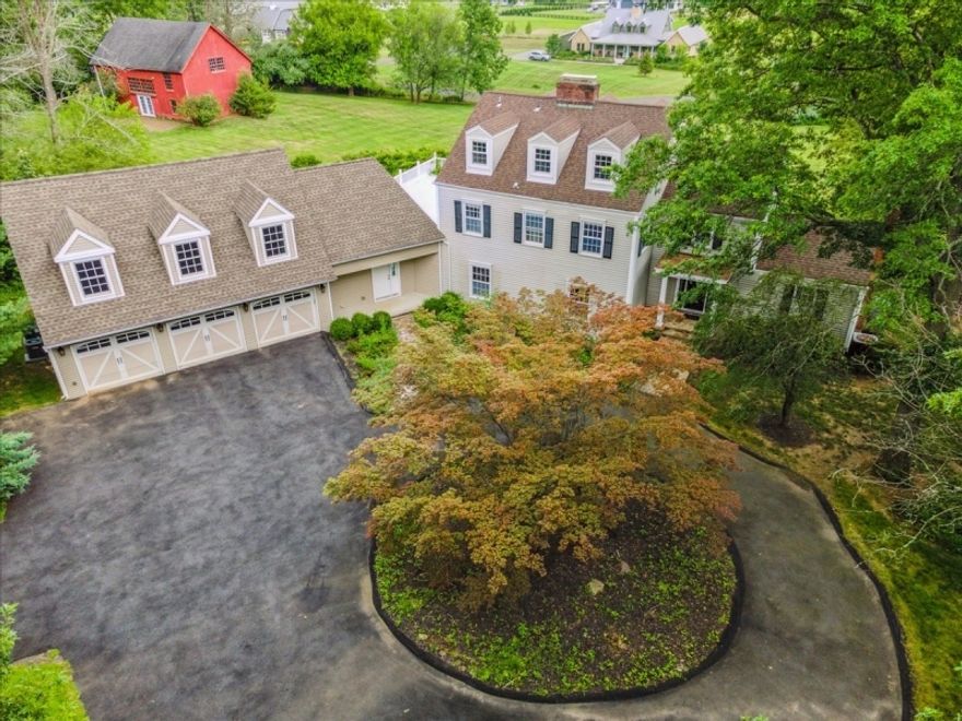 Elegant Custom Colonial, nestled on almost 4 acres offering 4 Bed, 4 Baths, 21/2 Baths, an office, oversized 3-car garage & a charming 2-story red barn. Near highly regarded schools, shops, eateries & minutes to the Far Hills NJ Transit train station to NYC. The spacious interior features floor to ceiling  windows offering panoramic views of the grounds, gleaming hardwood floors, crown molding, raised panel wainscoting & custom built-ins. A circular driveway & stone walkway guide you inside to a large foyer. Spacious living room has a wood burning fireplace. French doors open to rec-room perfect for entertaining w/wet bar, 1/2 bath & spectacular views from 4 sets of French doors opening to both patios. The formal dining room flows to the renovated, modern eat-in kitchen w/honed granite counters, coffee bar, double Thermidor ovens, 2 dishwashers, oversized center island, breakfast area & windows offering sweeping views of the property & beyond. The office includes a fireplace & walls of shelving + cabinets under a vaulted, wood-beamed ceiling. A separate side entrance to a bonus room that can be used as game room, gym, au pair suite. Mudroom with dog shower, laundry & access to the attached garage. The 2nd floor includes the primary bedroom suite w/huge WIC, lavish en suite bathroom, fireplace & French doors to a large, private terrace. There are 2 adit'l Bds, one w/en-suite bath, plus a full hall bathroom. The 3rd floor offers a spacious 4th Bd w/private full bath.